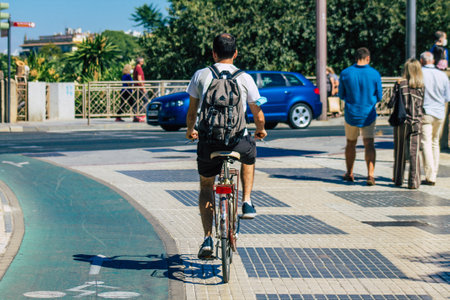 Seville Spain September 04, 2021 People rolling with a bicycle in the streets of Seville, an...