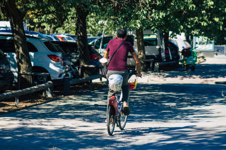 Seville Spain September 04, 2021 People rolling with a bicycle in the streets of Seville, an emblematic city and the capital of the region of Andalusia, in the south of Spainの写真素材
