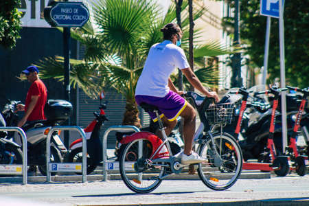 Seville Spain September 04, 2021 People rolling with a bicycle in the streets of Seville, an...