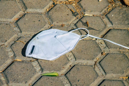 Seville Spain September 04, 2021 Surgical mask to protect against the coronavirus thrown in the streets of Seville during the coronavirus pandemic affecting Spainのeditorial素材