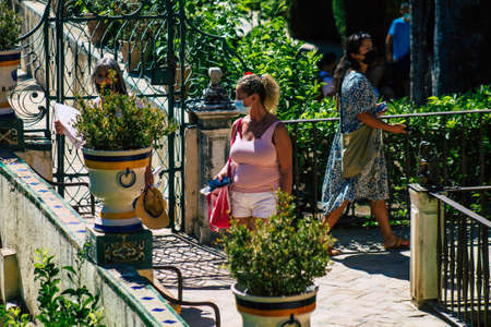 Seville Spain September 04, 2021 Tourists visiting The Alcazar of Seville and its gardens, considered the most brilliant example of Mudejar architecture in Spainのeditorial素材