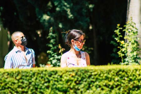 Seville Spain September 04, 2021 Tourists visiting The Alcazar of Seville and its gardens,...