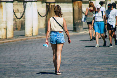 Seville Spain September 04, 2021 Pedestrians walking in the street during the coronavirus outbreak hitting Spain, wearing a mask is not mandatory but most of people wear itのeditorial素材