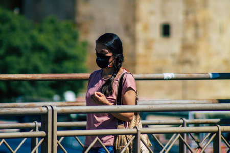 Seville Spain September 04, 2021 Pedestrians walking in the street during the coronavirus outbreak hitting Spain, wearing a mask is not mandatory but most of people wear itのeditorial素材