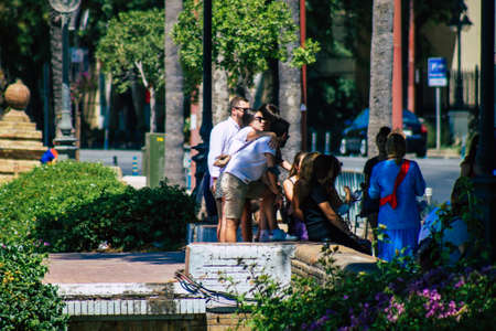 Seville Spain September 04, 2021 Pedestrians walking in the street during the coronavirus outbreak hitting Spain, wearing a mask is not mandatory but most of people wear itのeditorial素材