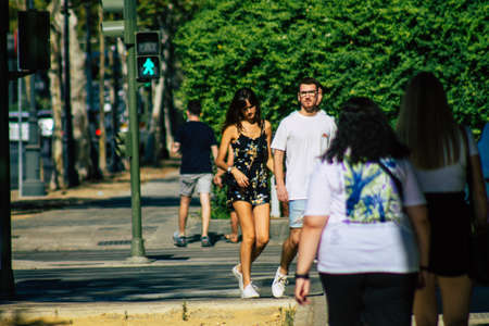 Seville Spain September 04, 2021 Pedestrians walking in the street during the coronavirus outbreak hitting Spain, wearing a mask is not mandatory but most of people wear itのeditorial素材