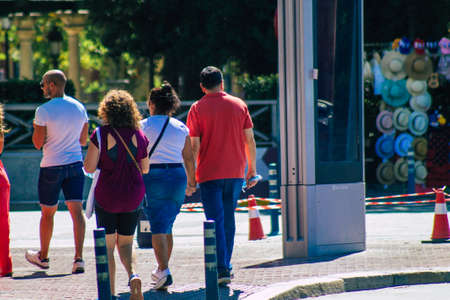 Seville Spain September 04, 2021 Pedestrians walking the street on a zebra crossing during the coronavirus outbreak hitting Spain, wearing a mask is not mandatory but most people wear itのeditorial素材