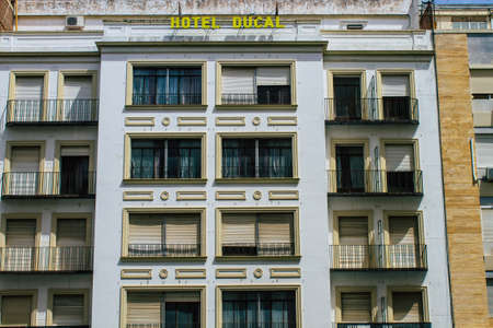 Seville Spain August 10, 2021 Facade of a building in the streets of Seville, an emblematic city and the capital of the region of Andalusia, in the south of Spainのeditorial素材