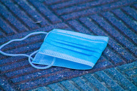 Seville Spain September 18, 2021 Surgical mask to protect against the coronavirus thrown in the streets of Seville during the coronavirus pandemic affecting Spainの写真素材