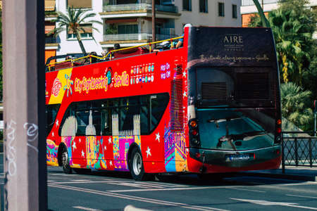 Seville Spain September 04, 2021 Tourist bus driving through the streets of Seville during the coronavirus outbreak hitting Spain, wearing a mask is mandatoryのeditorial素材
