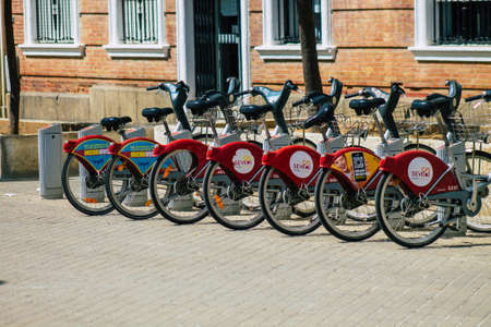 Seville Spain September 22, 2021 Accessible bicycles to hire for short periods of time, usually for a few hours parked in the street and part of the public transport system of Sevilleの写真素材