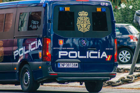 Seville Spain September 15, 2021 Police car patrolling in the streets of Seville during the coronavirus outbreak hitting Spain, wearing a mask in the street is not mandatoryのeditorial素材