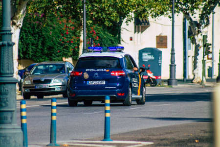 Seville Spain September 15, 2021 Police car patrolling in the streets of Seville during the coronavirus outbreak hitting Spain, wearing a mask in the street is not mandatoryのeditorial素材