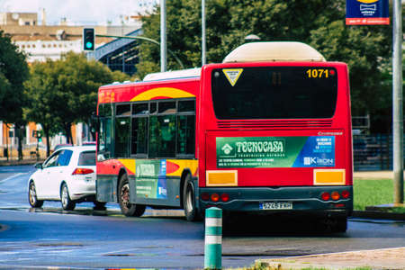Seville Spain September 15, 2021 Bus driving through the streets of Seville during the coronavirus outbreak hitting Spain, wearing a mask is mandatoryのeditorial素材