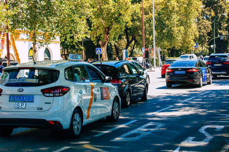 Seville Spain September 18, 2021 Taxi driving through the streets of Seville during the coronavirus outbreak hitting Spain, wearing a mask is mandatoryのeditorial素材