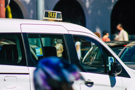 Seville Spain September 18, 2021 Taxi driving through the streets of Seville during the coronavirus outbreak hitting Spain, wearing a mask is mandatoryのeditorial素材