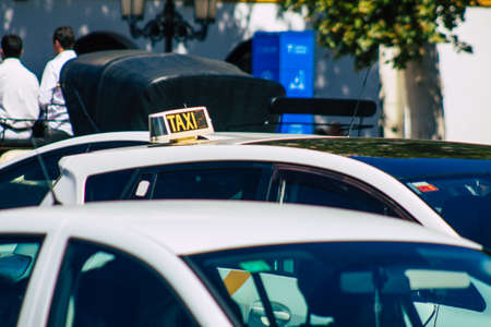 Seville Spain September 18, 2021 Taxi driving through the streets of Seville during the coronavirus...