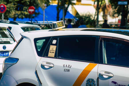 Seville Spain September 18, 2021 Taxi driving through the streets of Seville during the coronavirus outbreak hitting Spain, wearing a mask is mandatoryのeditorial素材