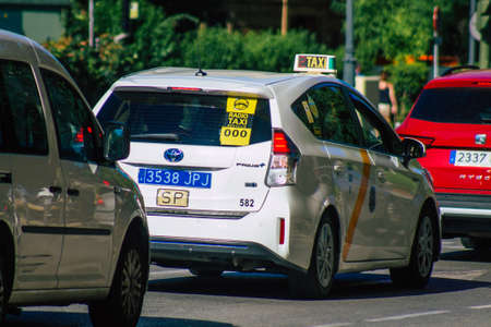 Seville Spain September 18, 2021 Taxi driving through the streets of Seville during the coronavirus outbreak hitting Spain, wearing a mask is mandatoryのeditorial素材