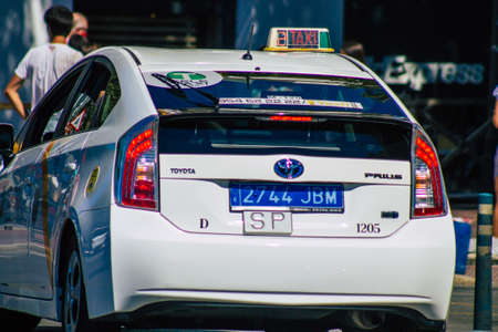 Seville Spain September 18, 2021 Taxi driving through the streets of Seville during the coronavirus outbreak hitting Spain, wearing a mask is mandatoryのeditorial素材
