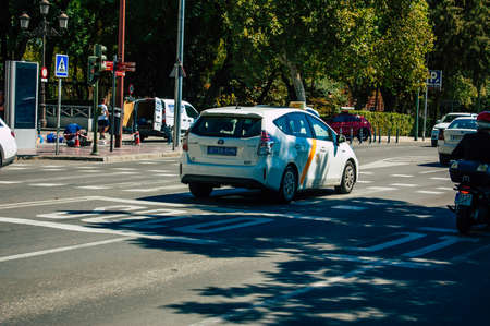 Seville Spain September 18, 2021 Taxi driving through the streets of Seville during the coronavirus outbreak hitting Spain, wearing a mask is mandatoryのeditorial素材