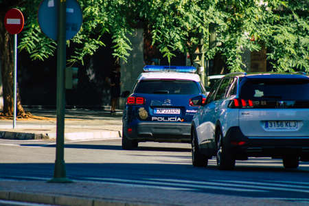 Seville Spain September 18, 2021 Police car patrolling in the streets of Seville during the coronavirus outbreak hitting Spain, wearing a mask in the street is not mandatoryのeditorial素材