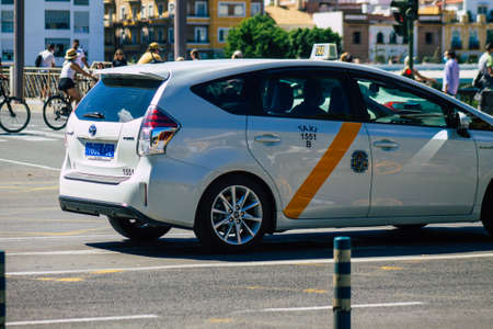 Seville Spain September 18, 2021 Taxi driving through the streets of Seville during the coronavirus outbreak hitting Spain, wearing a mask is mandatoryのeditorial素材