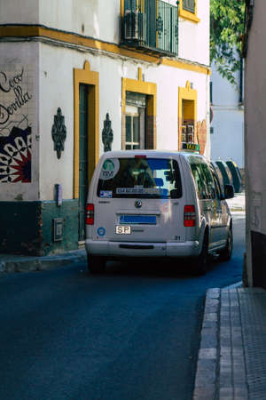 Seville Spain September 18, 2021 Taxi driving through the streets of Seville during the coronavirus outbreak hitting Spain, wearing a mask is mandatoryのeditorial素材