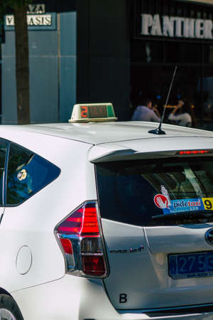 Seville Spain September 18, 2021 Taxi driving through the streets of Seville during the coronavirus outbreak hitting Spain, wearing a mask is mandatoryのeditorial素材