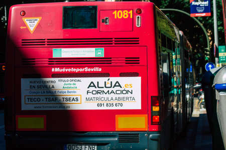 Seville Spain September 18, 2021 Bus driving through the streets of Seville during the coronavirus outbreak hitting Spain, wearing a mask is mandatoryのeditorial素材