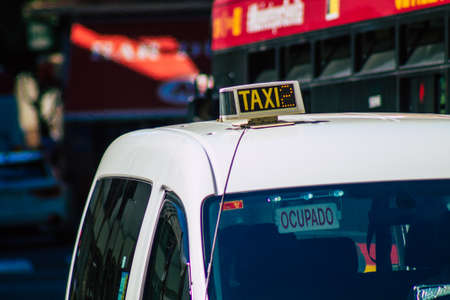 Seville Spain September 18, 2021 Taxi driving through the streets of Seville during the coronavirus outbreak hitting Spain, wearing a mask is mandatoryのeditorial素材