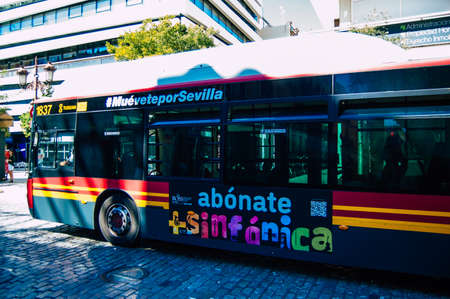 Seville Spain September 18, 2021 Bus driving through the streets of Seville during the coronavirus outbreak hitting Spain, wearing a mask is mandatoryのeditorial素材