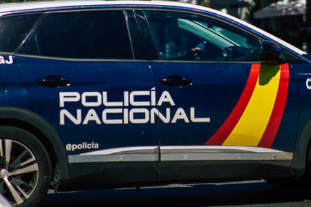 Seville Spain September 18, 2021 Police car patrolling in the streets of Seville during the coronavirus outbreak hitting Spain, wearing a mask in the street is not mandatoryのeditorial素材