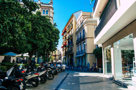 Seville Spain September 18, 2021 Motorcycles parked in the streets of Seville, an emblematic city and the capital of the region of Andalusia, in the south of Spainのeditorial素材