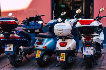 Seville Spain September 18, 2021 Motorcycles parked in the streets of Seville, an emblematic city and the capital of the region of Andalusia, in the south of Spainのeditorial素材