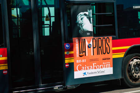 Seville Spain September 18, 2021 Bus driving through the streets of Seville during the coronavirus outbreak hitting Spain, wearing a mask is mandatoryのeditorial素材