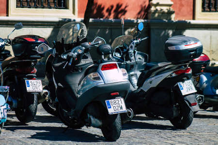 Seville Spain September 18, 2021 Motorcycles parked in the streets of Seville, an emblematic city and the capital of the region of Andalusia, in the south of Spainのeditorial素材