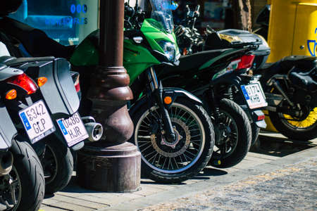 Seville Spain September 18, 2021 Motorcycles parked in the streets of Seville, an emblematic city and the capital of the region of Andalusia, in the south of Spainのeditorial素材