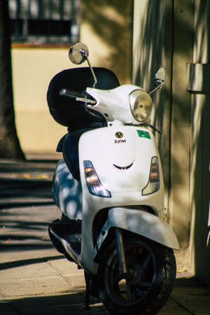 Seville Spain September 18, 2021 Motorcycles parked in the streets of Seville, an emblematic city and the capital of the region of Andalusia, in the south of Spainのeditorial素材