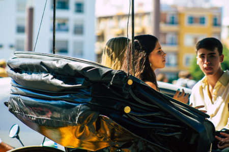 Seville Spain September 18, 2021 Horse drawn carriage ride through the streets of Seville during the coronavirus outbreak hitting Spain, wearing a mask is mandatoryのeditorial素材