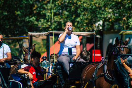 Seville Spain September 18, 2021 Horse drawn carriage ride through the streets of Seville during the coronavirus outbreak hitting Spain, wearing a mask is mandatoryのeditorial素材