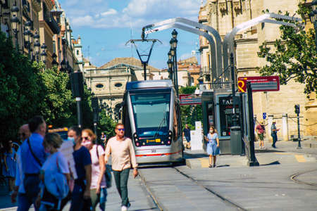 Seville Spain September 18, 2021 Modern electric tram for passengers rolling through the streets of Seville during the coronavirus outbreak hitting Spain, wearing a mask is mandatoryのeditorial素材