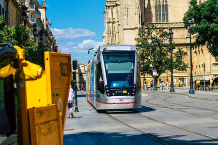 Seville Spain September 18, 2021 Modern electric tram for passengers rolling through the streets of Seville during the coronavirus outbreak hitting Spain, wearing a mask is mandatoryのeditorial素材