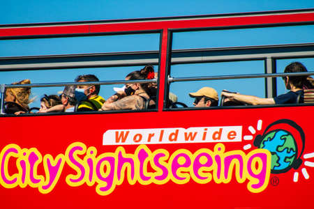 Seville Spain September 18, 2021 Tourist bus driving through the streets of Seville during the coronavirus outbreak hitting Spain, wearing a mask is mandatoryのeditorial素材