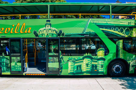 Seville Spain September 18, 2021 Tourist bus driving through the streets of Seville during the coronavirus outbreak hitting Spain, wearing a mask is mandatoryのeditorial素材