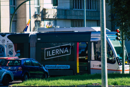 Seville Spain September 18, 2021 Modern electric tram for passengers rolling through the streets of Seville during the coronavirus outbreak hitting Spain, wearing a mask is mandatoryのeditorial素材