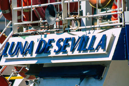 Seville Spain September 18, 2021 Tourist boats on the Guadalquivir River that crosses Seville, an emblematic city and the capital of the region of Andalusia, in the south of Spainのeditorial素材