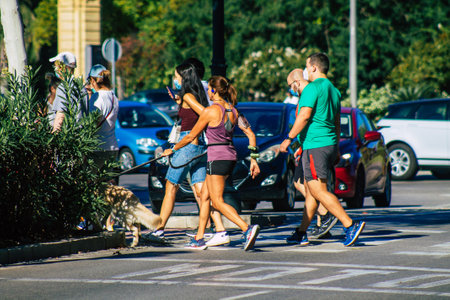 Seville Spain September 18, 2021 Pedestrians walking in the street during the coronavirus outbreak hitting Spain, wearing a mask is not mandatory but most of people wear itのeditorial素材