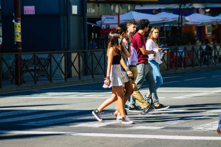 Seville Spain September 18, 2021 Pedestrians walking in the street during the coronavirus outbreak hitting Spain, wearing a mask is not mandatory but most of people wear itのeditorial素材