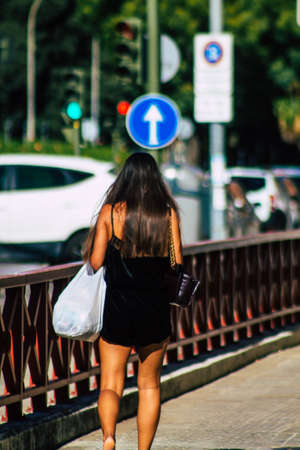 Seville Spain September 18, 2021 Pedestrians walking in the street during the coronavirus outbreak hitting Spain, wearing a mask is not mandatory but most of people wear itのeditorial素材